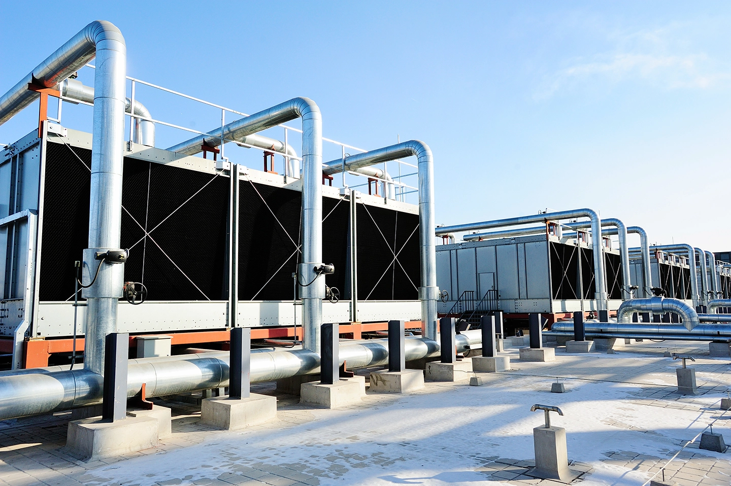 Sets of cooling towers atop a data center building.