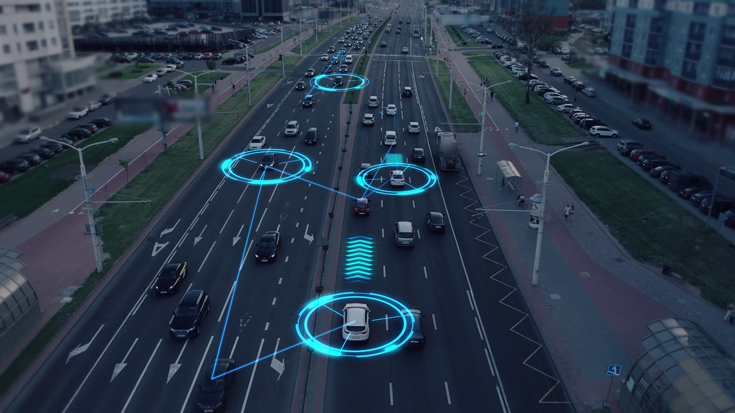 Figure 2: Visualization of the interaction of self-driving autonomous vehicles. Robotic cars are controlled by AI, driving along a busy city avenue, scanning the road with sensors, and exchanging information.